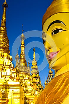 Vertical shot of the big statue of Gautama Buddha in Ngar Htat Gyi Pagoda, Yangon, Myanmar photo