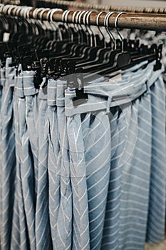 Vertical shot of blue skirts with white stripes