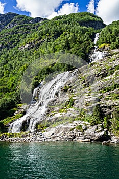 Vertical shot of The Bridal Veil waterfall at Geirangerfjord, Sunnmore, More og Romsdal, Norway