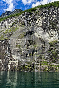 Vertical shot of The Bridal Veil waterfall at Geirangerfjord, Sunnmore, More og Romsdal, Norway