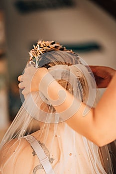 Vertical shot of a bride getting ready for the wedding
