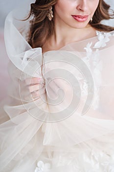 Vertical shot with bride`s hands in focus. Wedding concepts, details, ideas and themes, bride morning