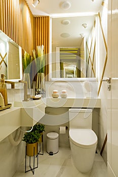 Vertical shot of the bright bathroom with a modern interior