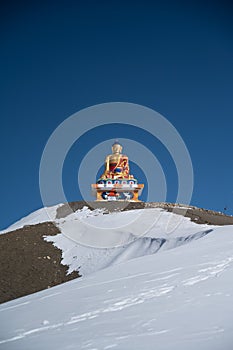 Vertical shot of Buddha statue in Langza village, Spiti Valley in winter