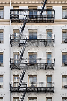 Vertical shot of a building with balconies and stairs