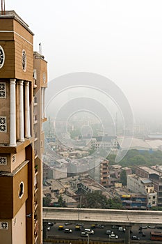 Vertical shot with buildings and smog in Noida Delhi