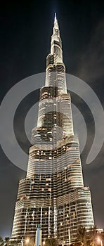 Vertical shot of the Burj Khalifa skyscraper in Dubai illuminated at night