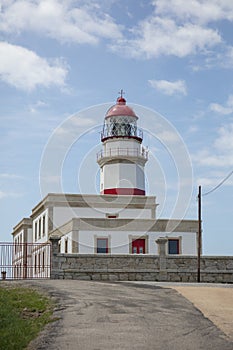 Vertical shot of Cabo Silleiro lighthouse in Galicia, Spain photo