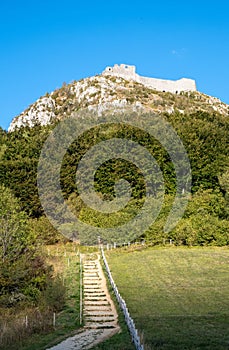 Vertical shot of Castle Montsegur on top of the hill in Cathar country, Ariege, Occitanie, France