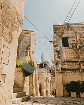 Vertical shot of the Cathedral of San Sabino seen between buildings in Bari, Italy