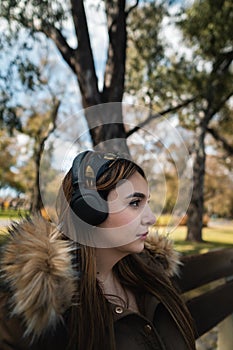 Vertical shot of caucasian woman listening music