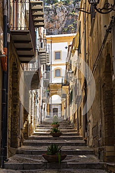 Vertical shot of Cefalu Old Town buildings and staircases in Sicily, Italy