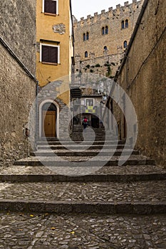 Vertical shot of Cefalu Old Town and Castle with buildings and staircases in Sicily, Italy