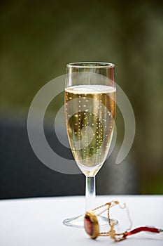 Vertical shot of a champagne glass and cork