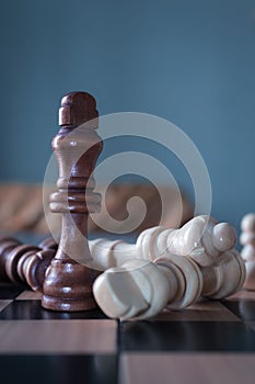 Vertical shot of chess figures - the concept of overcoming the challenges and succeeding