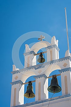 Vertical shot of church bells in Emporio village. Santorini, Greece