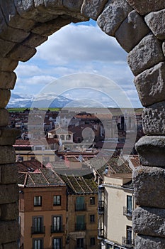 Vertical shot of a cityscape from ancient Roman aqueduct on Plaza del Azoguejo photo