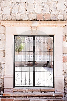 Vertical shot of closed metal doors with a blurred background