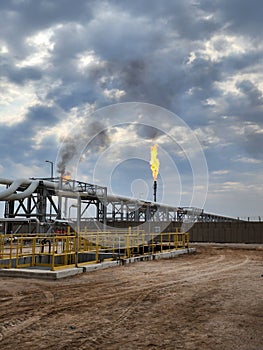 Vertical shot of coal power plant with smoking chimneys. Air pollution concept.