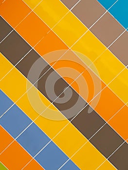 Vertical shot of colorful square tile texture, diagonal pattern