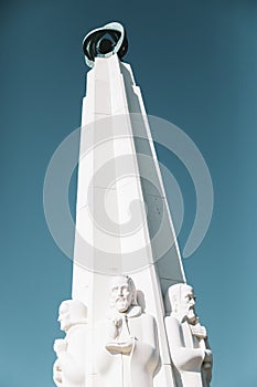 Vertical shot of the column with statues in Griffith Park Observatory Los Angeles
