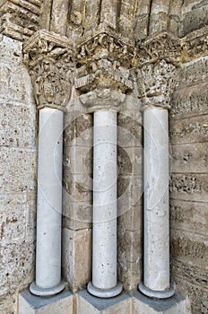 Vertical shot of columns of the 12th century church in Arroyo de la Encomienda in Valladolid photo