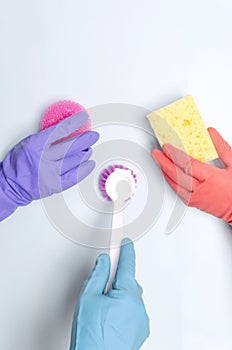 Vertical shot.Concept of cleaning compony and cleaning team.Workers holding variois of cleaning supplies for washing and removing