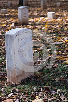 Vertical shot of Confederate grave headstones in the Stones River Battlefield & Cemetery, Tennessee