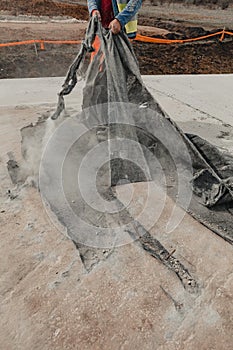 Vertical shot of a construction worker doing concrete laying