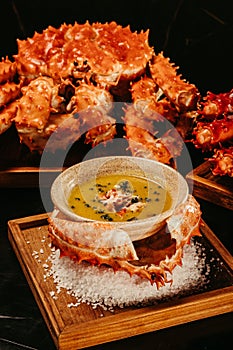 A vertical shot of cooked crab with a sauce