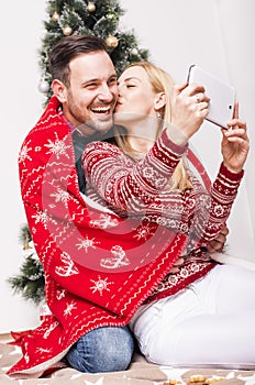 Vertical shot of a couple enjoying  each others accompaniment on Christmas holidays