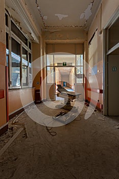 Vertical shot of a damaged interior with corridors and windows