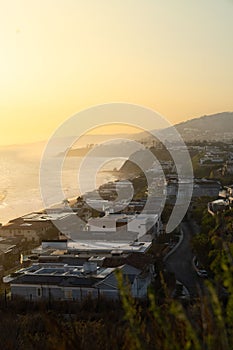 Vertical shot of Dana Point city in California at sunset with houses on the Dana Point Harbor