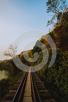 Vertical shot of Death Railway under a blue sky, Thailand