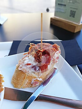 Vertical shot of a delicious pincho in a restaurant