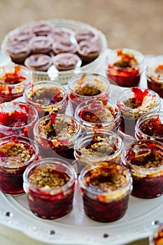 Vertical shot of desserts in jars, Trifles. This Blackberry Crisp in Jar