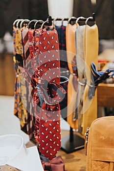 A vertical shot of a display of patterned formal bowties
