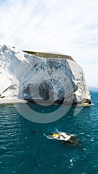 Vertical shot of a diver swimming next to the Isle of Wight in the United Kingdom