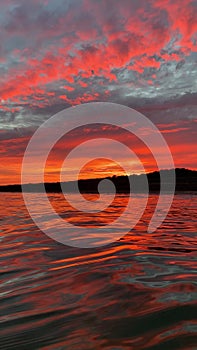 Vertical shot of a dramatic sunset over the sea