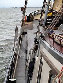 Vertical shot of a dutch flatboat in the open sea at daytime