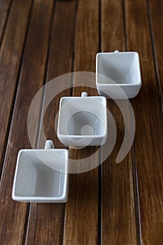 Vertical shot of an empty cups on a wooden table