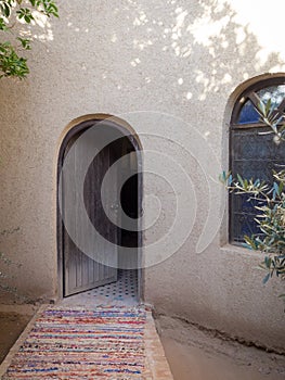 Vertical shot of the entrance of an old house in the Sahara desert in Morocco