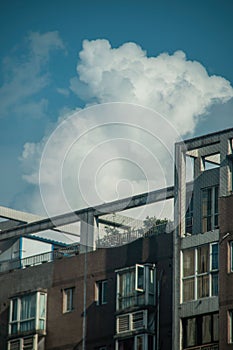 Vertical shot of a facade of a building under the sky with clouds in Meishan, Sichuan, China