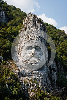 Vertical shot of the famous Statue of Decebal carved in the mountain in Iron Gates Natural Park