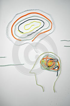 Vertical shot of a figure of a man's head with the figure of an idea - invention concept