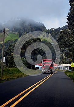 Vertical shot of a fire engine and smoke near the forest in Costa Rica, Cartago