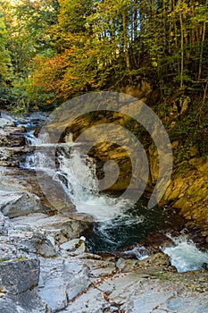 Vertical shot of the flowing Cubo waterfall in Ochagavia, Spain photo