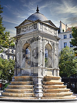 Vertical shot of the Fontaine des Innocents in Paris