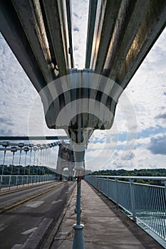 Vertical shot of the footpath and handrails of the Menai Suspension Bridge. Anglesey, Wales.