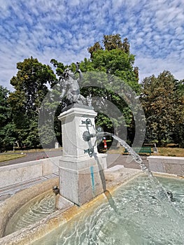 Vertical shot of a fountain in a park in Geneve, Switzerland